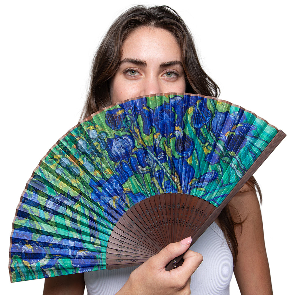 Female model holding a Getty Irises fan