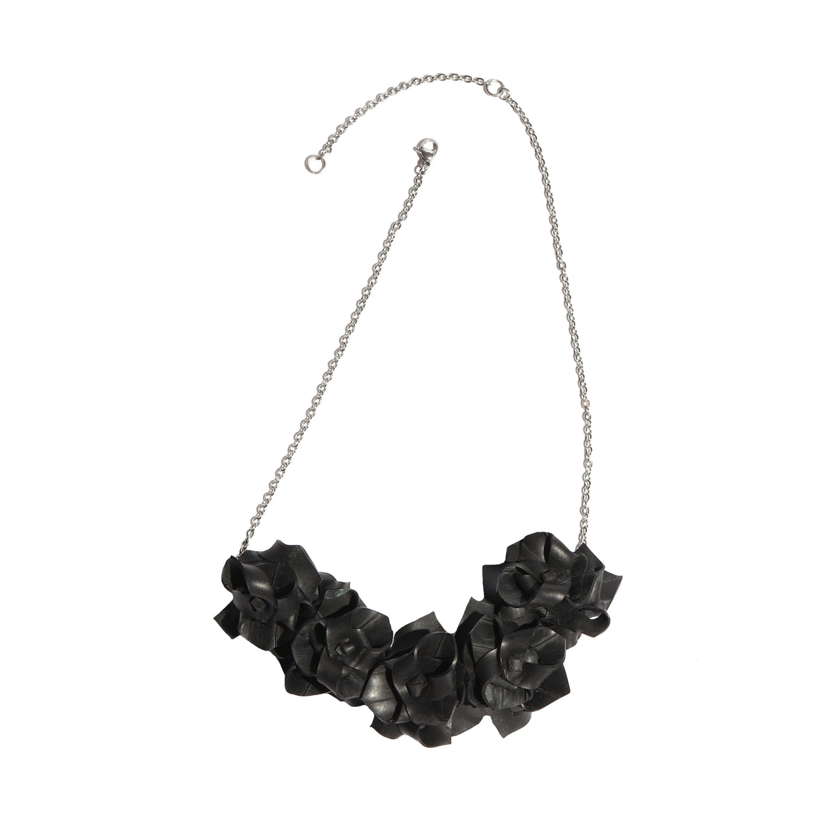 Black floral necklace on a white background