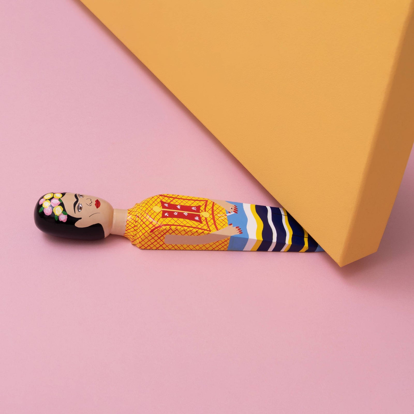 Colorful figurine of a woman with a traditional dress on a white background