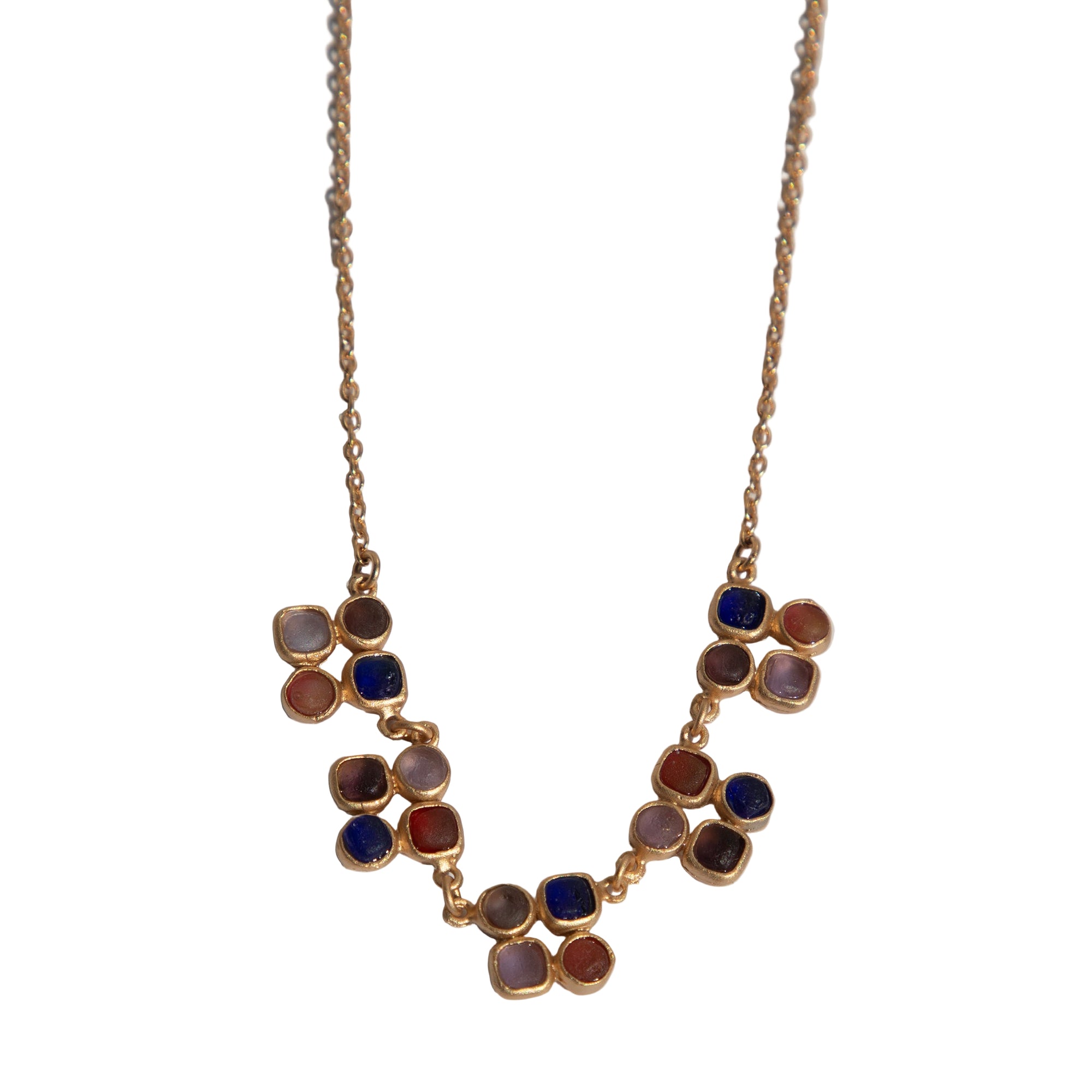 Necklace with floral design on a light gray background