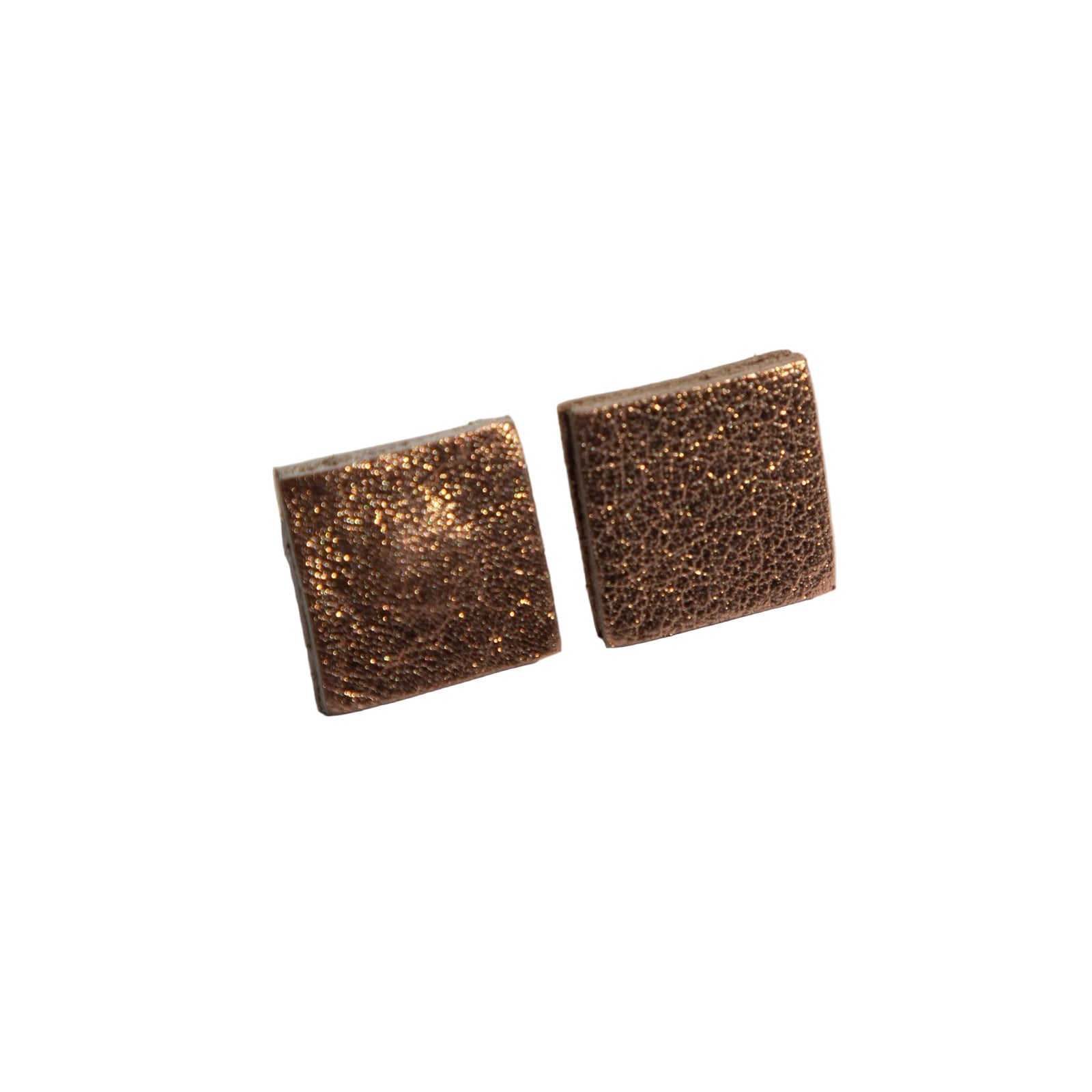 Pair of square-shaped bronze earrings on a light gray background