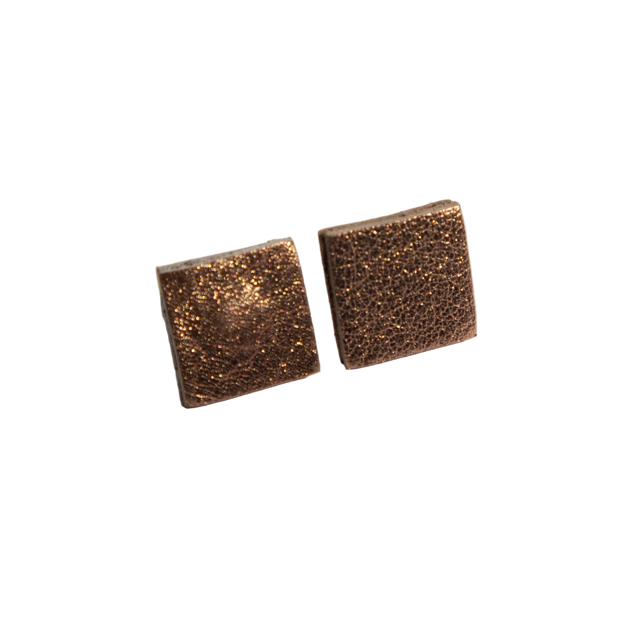Pair of square-shaped bronze earrings on a light gray background