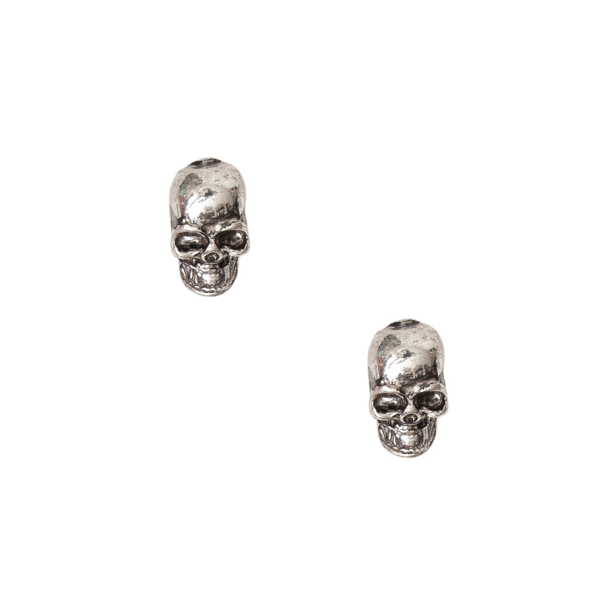 Pair of skull earrings on a white background