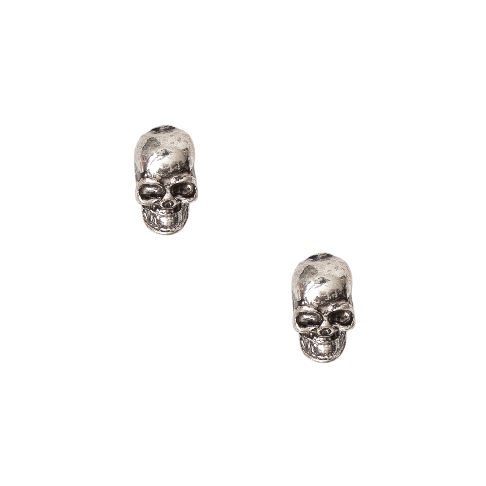 Pair of skull earrings on a white background