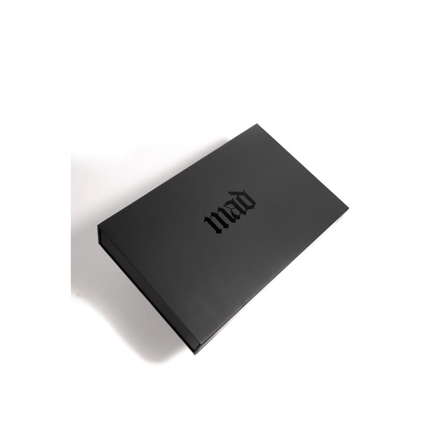 Black box with the word MAD on cover