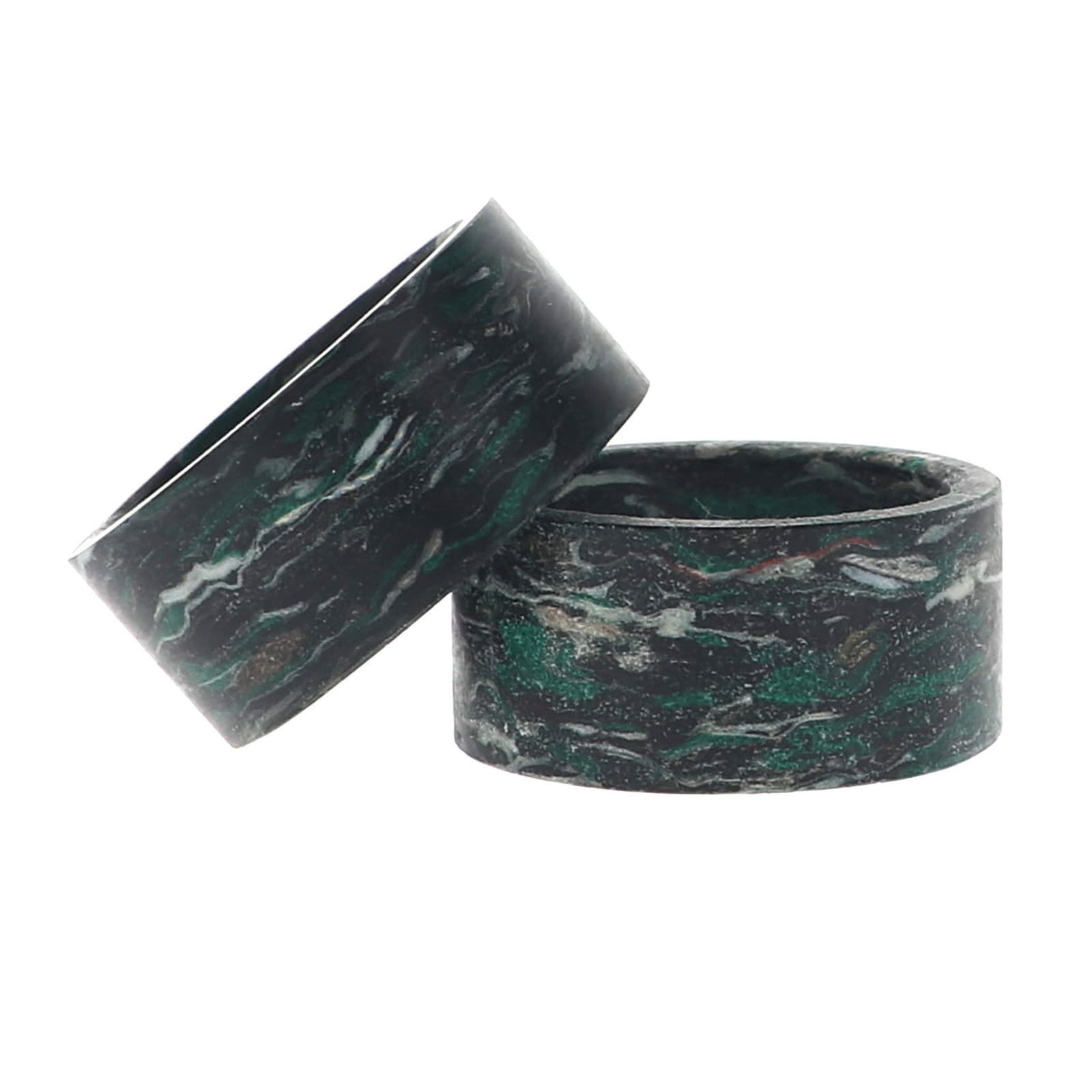 A napkin ring with swirling patterns of dark green, black, and white, shown against a plain white background.