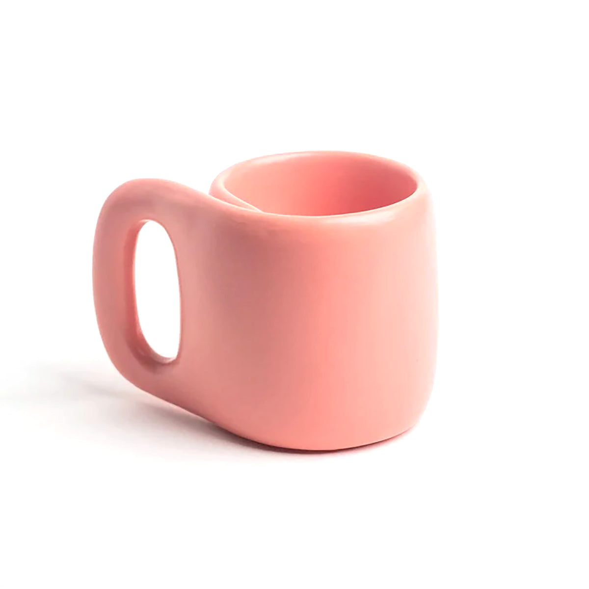 A small pink ceramic mug with a rounded body and a uniquely shaped loop handle, shown on a clean white background.