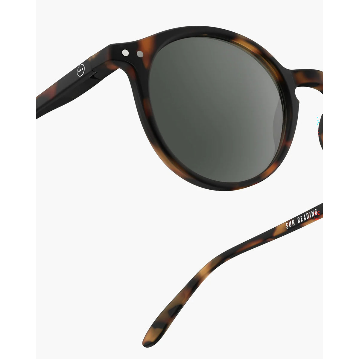 Round sunglasses with a dark brown and black tortoiseshell frame and dark gray lenses, shown on a light gray background with one lens and the other arm visible.