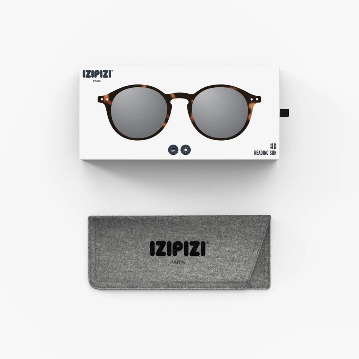 Izipizi reading sunglasses with tortoiseshell frames and dark gray lenses, shown with its white retail box and a gray fabric case below on a clean white background.