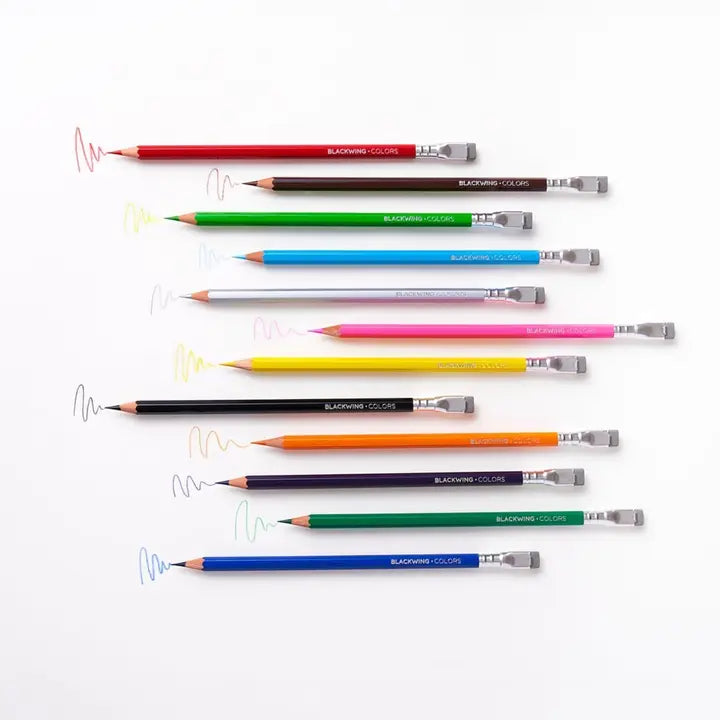 Set of colorful pencils arranged in a row on a white background