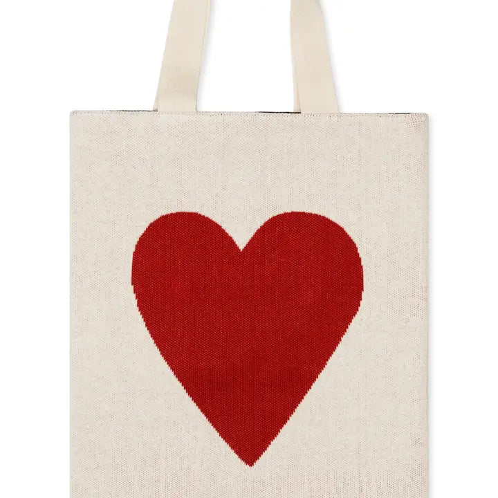 Beige tote bag with a red heart on a white background