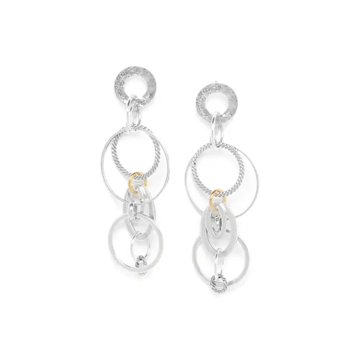 Silver earrings with circular designs on a white background