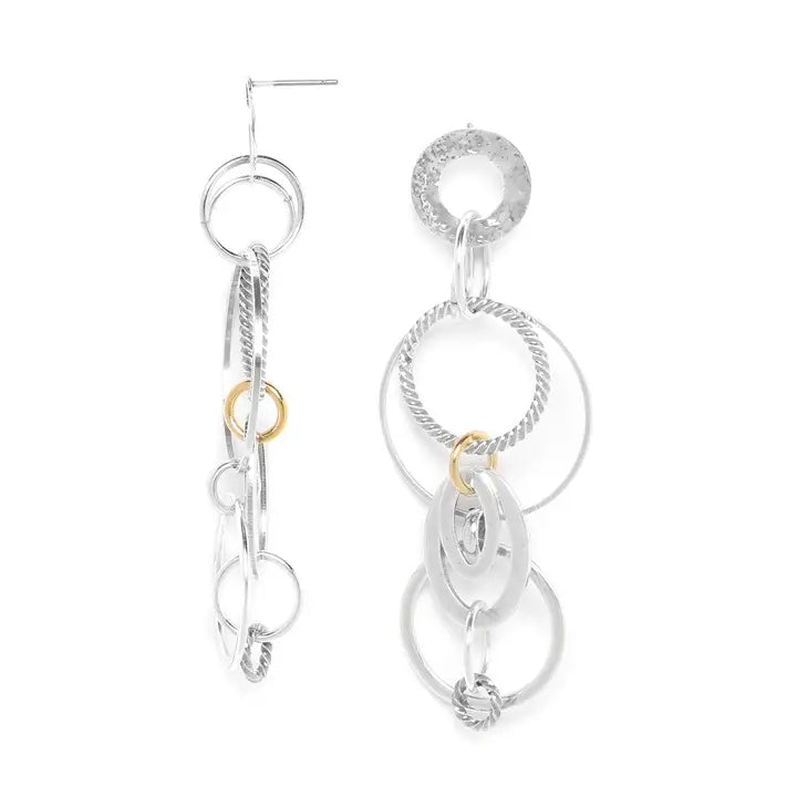 Silver and gold hoop earrings on a white background