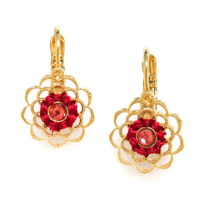 Gold earrings with red floral design on a white background