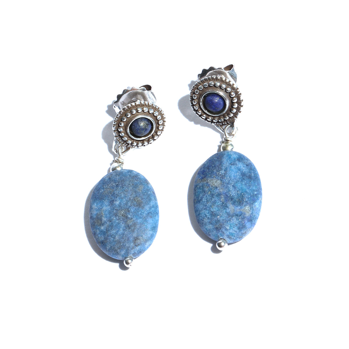 Pair of earrings with blue stones and silver accents on a white background
