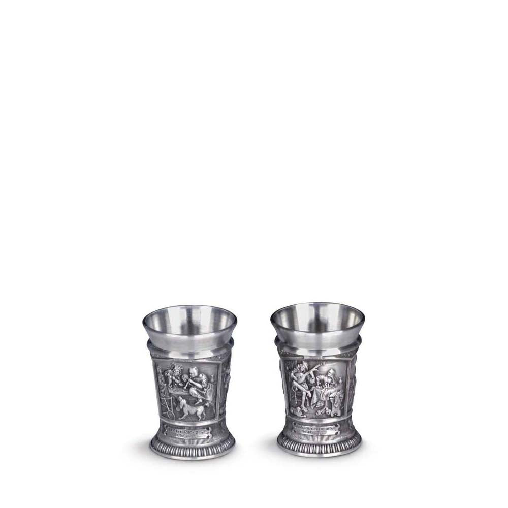 Two silver cups with embossed designs on a white background