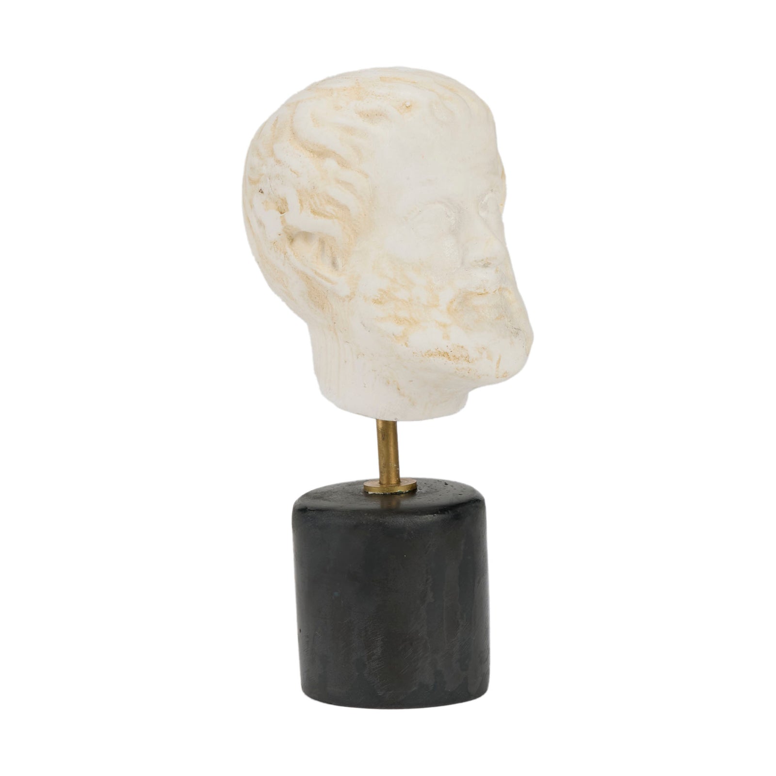 Decorative sculpture of a head on a black cylindrical base with a white background