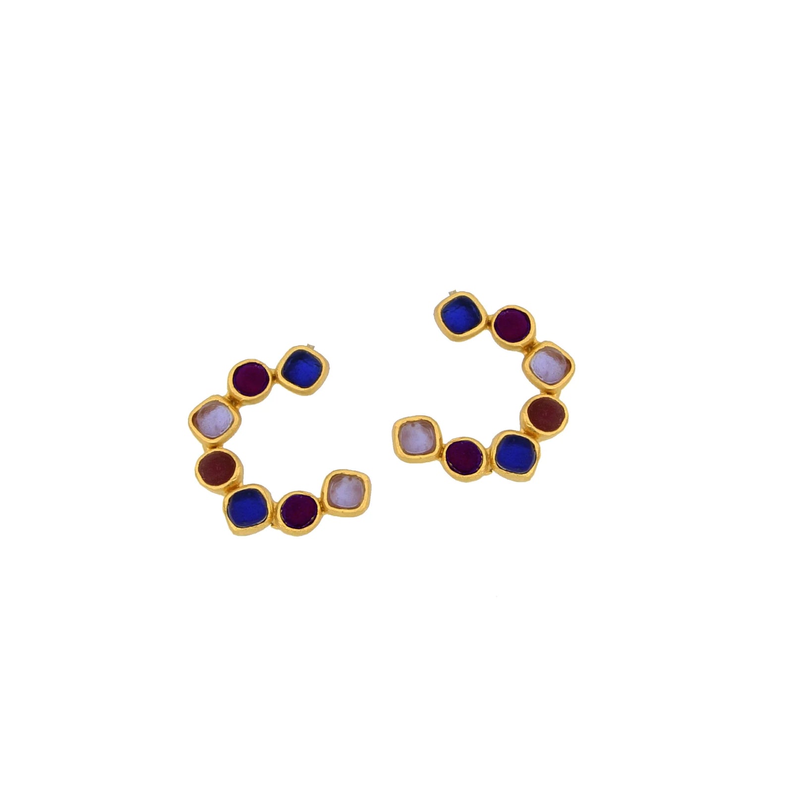 Pair of gold earrings with multicolored gemstones on a white background