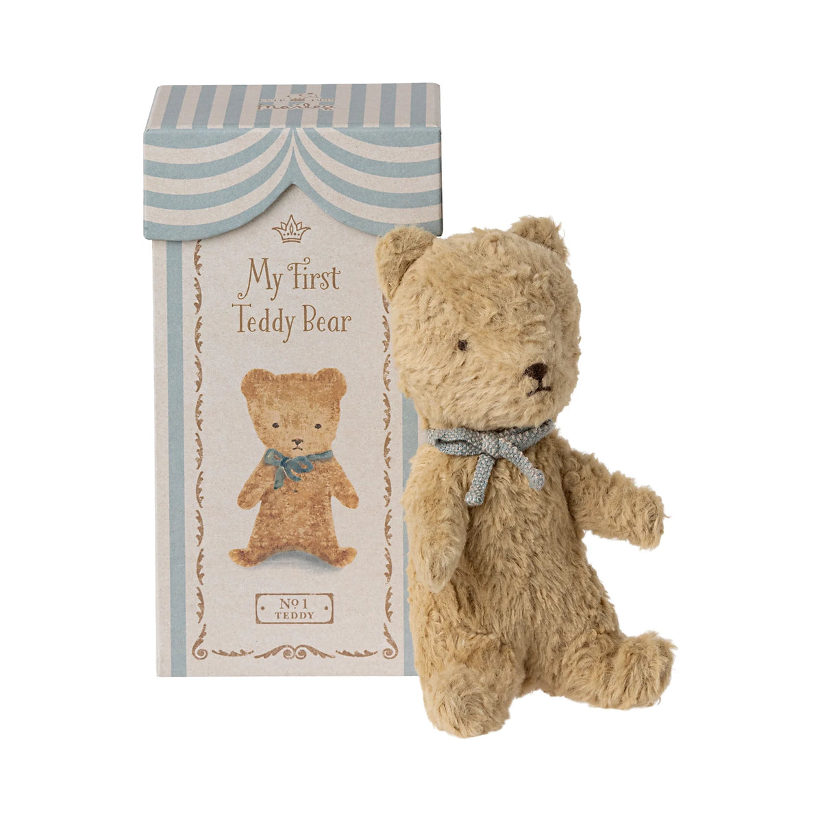 Teddy bear with a decorative box on a white background