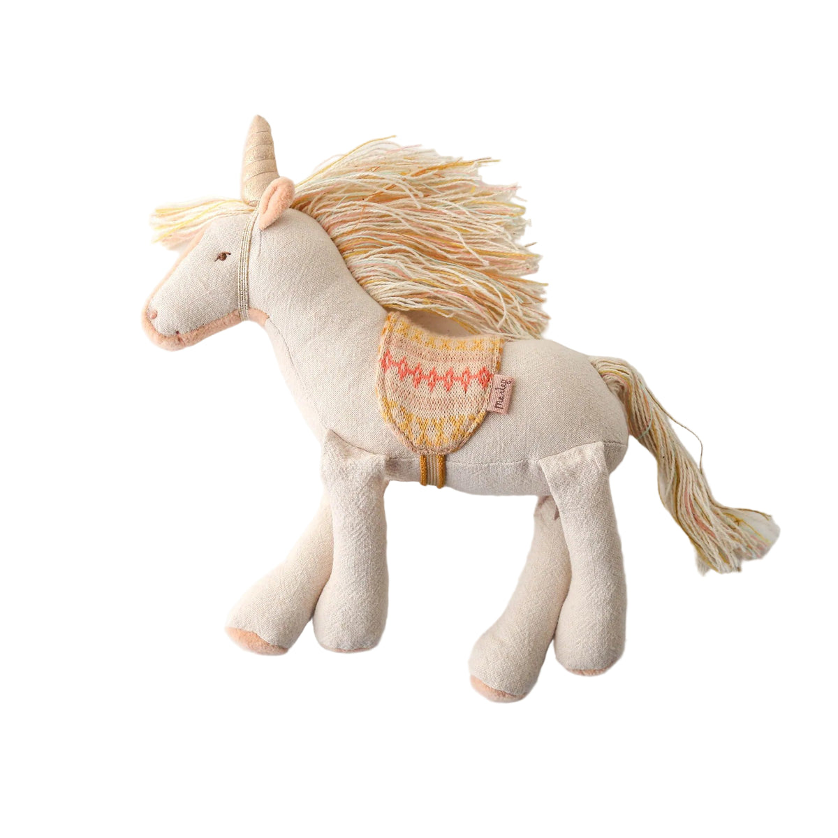 Stuffed unicorn toy with a decorative saddle on a white background