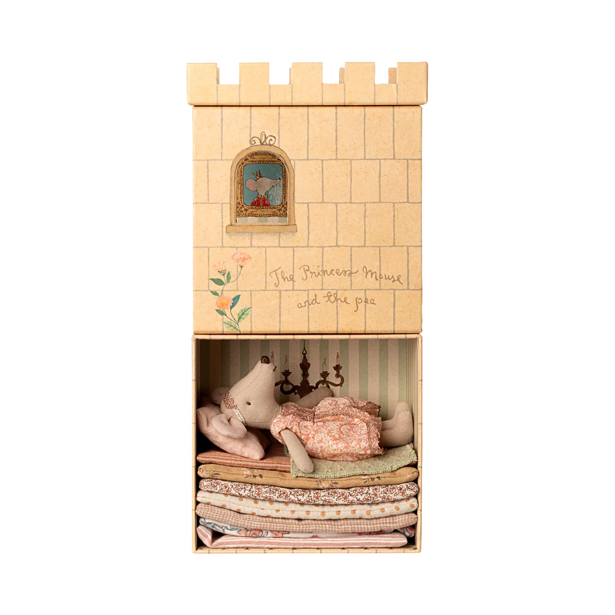 Wooden castle toy with plush toys inside on a white background