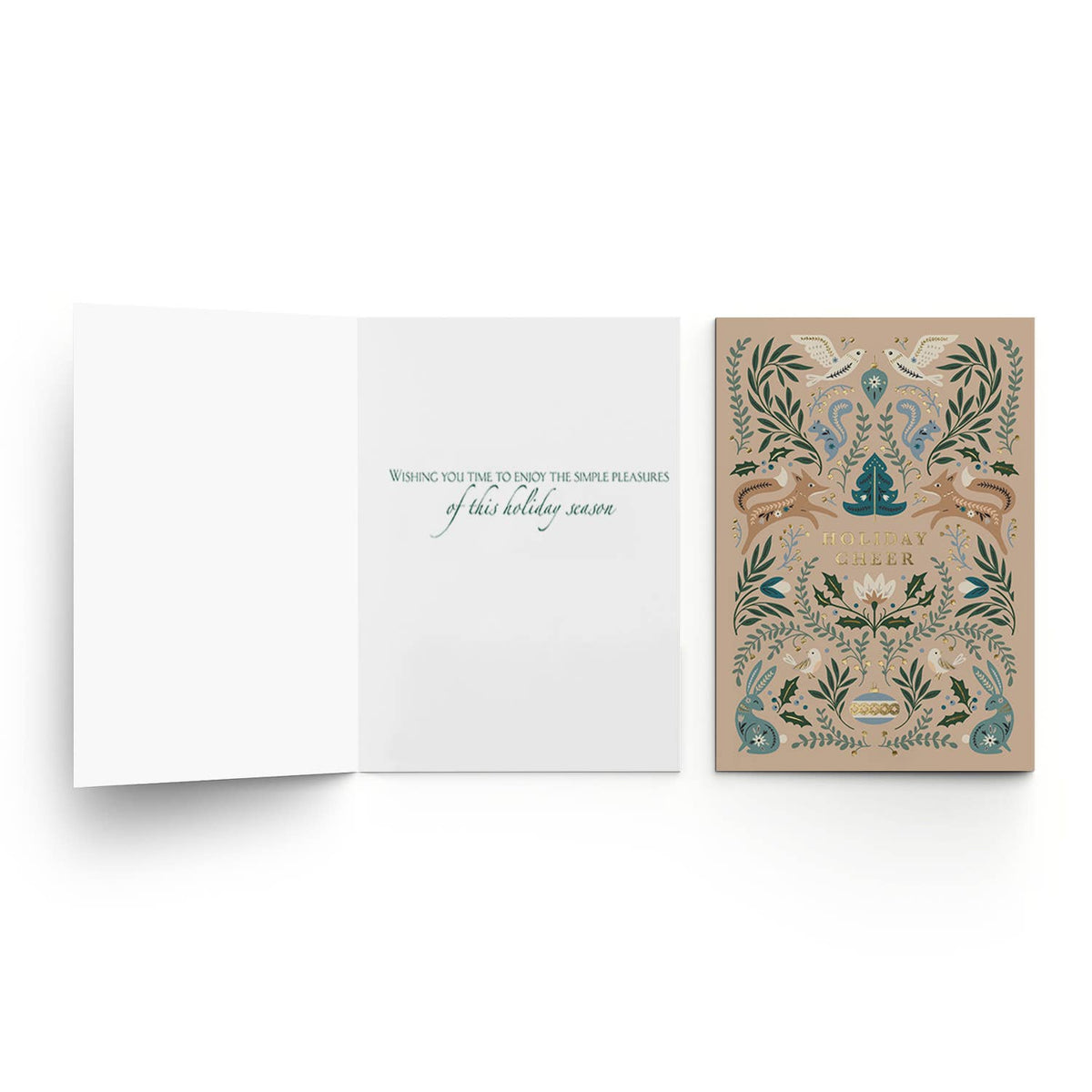 An open greeting card on a white background, showing a white interior with teal text, next to a closed illustrated card featuring a beige background with ornate green foliage, blue birds, and a central blue tree emblem.
