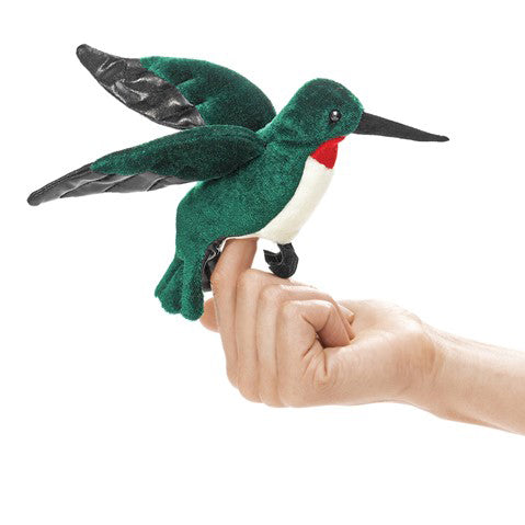 Finger inserted into plush hummingbird puppet with a white chest, red neck, and green wings against a white background