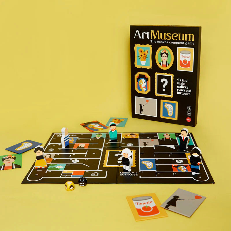 Board game set up with pieces and cards on a yellow background, featuring the 'Art Museum' game box.