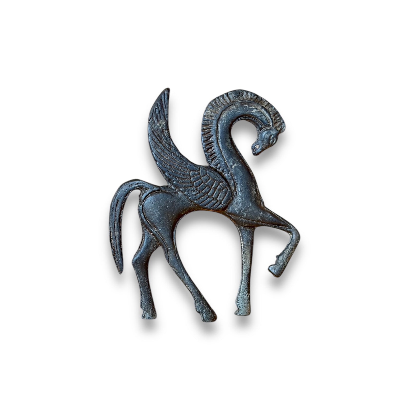 A bronze figurine of Pegasus, the winged horse, with a dark patina, standing in a dynamic pose with its head raised.
