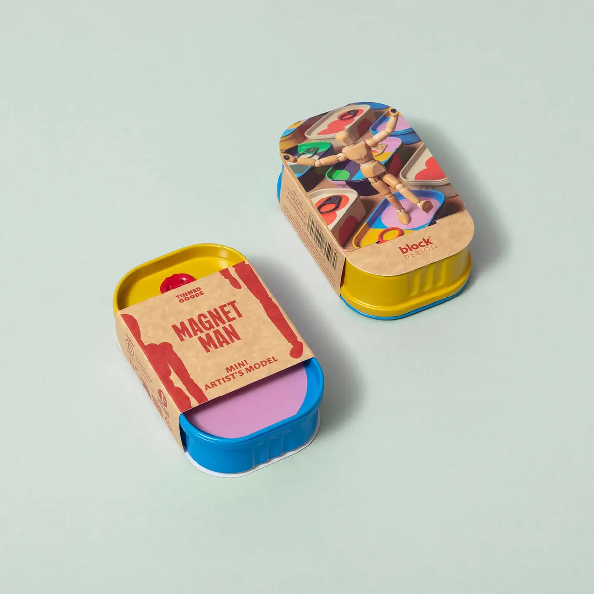 Two colorful tins with 'Magnet Man' packaging on a light gray background