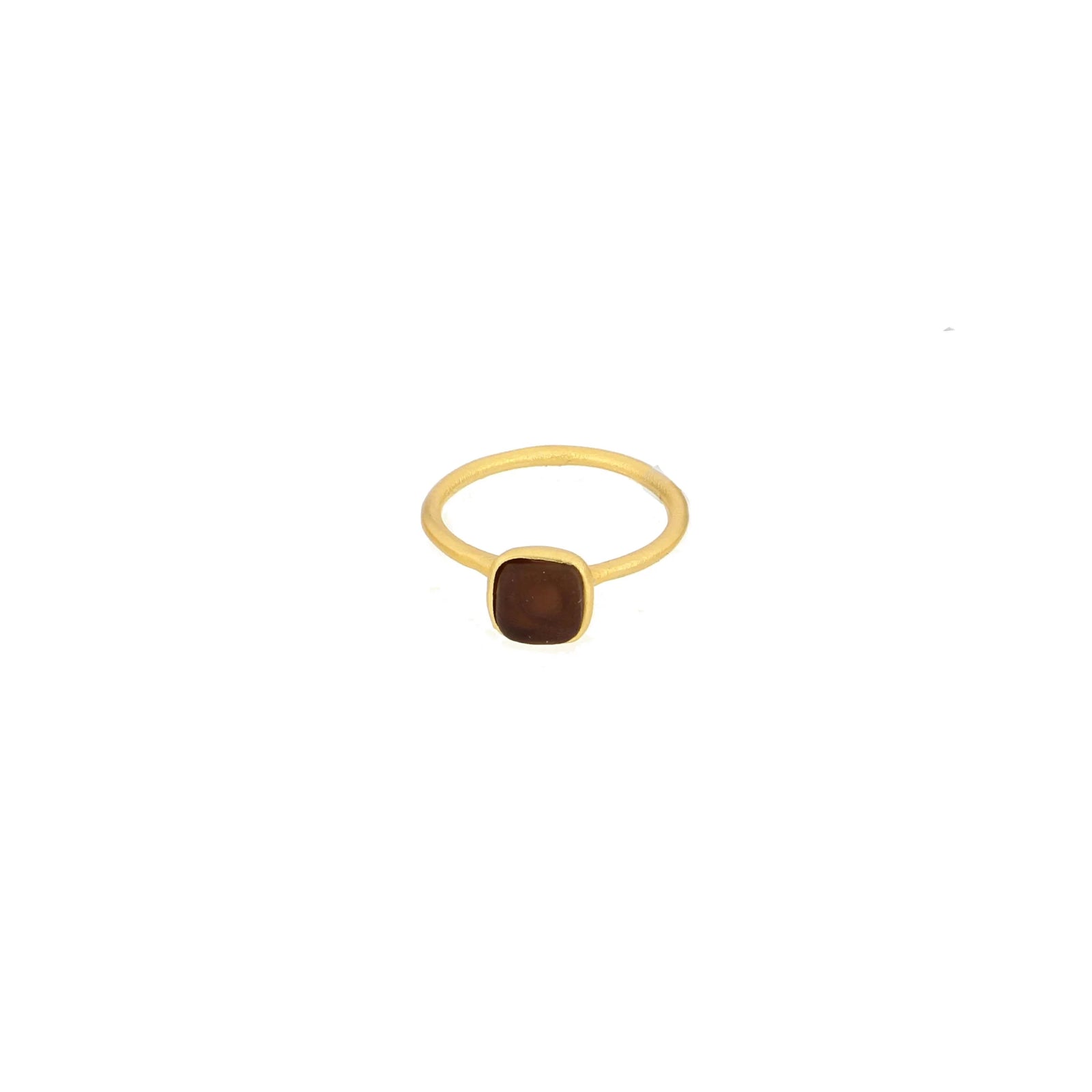 Gold ring with a brown gemstone on a white background
