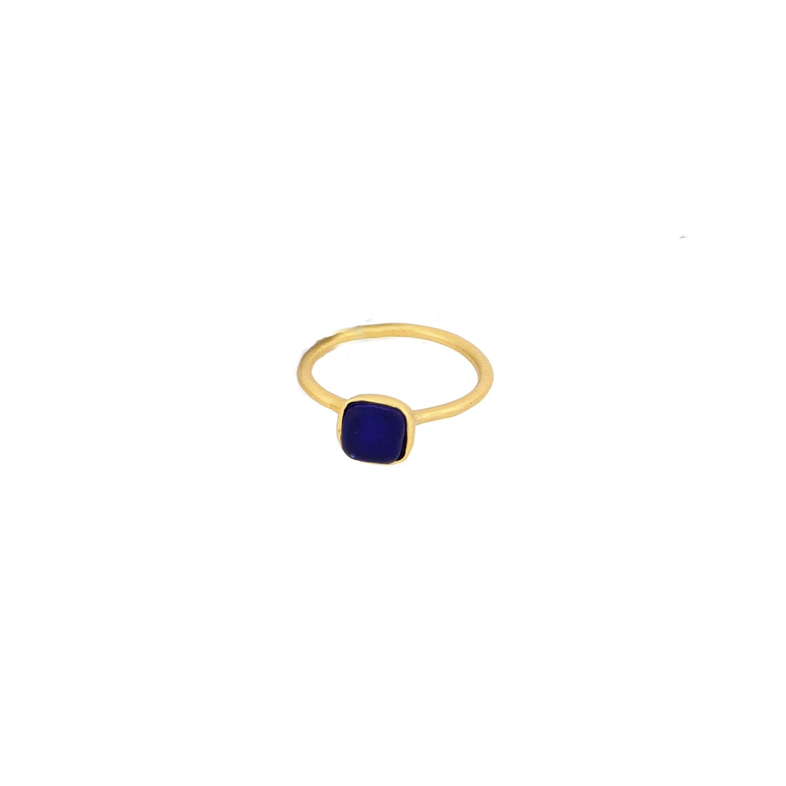 Gold ring with a blue gemstone on a white background