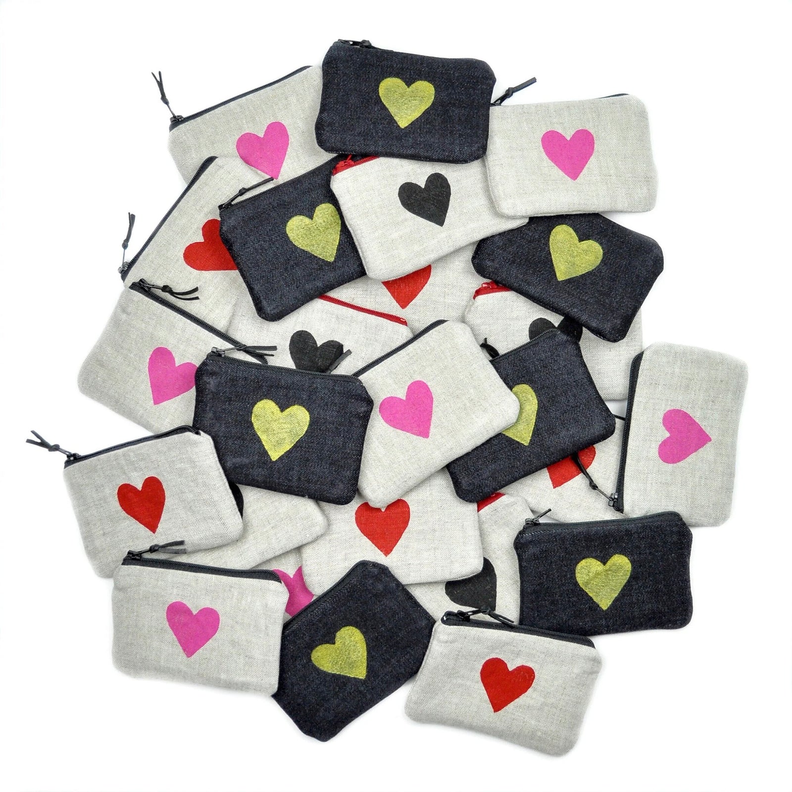 Collection of small pouches with heart designs on a white background