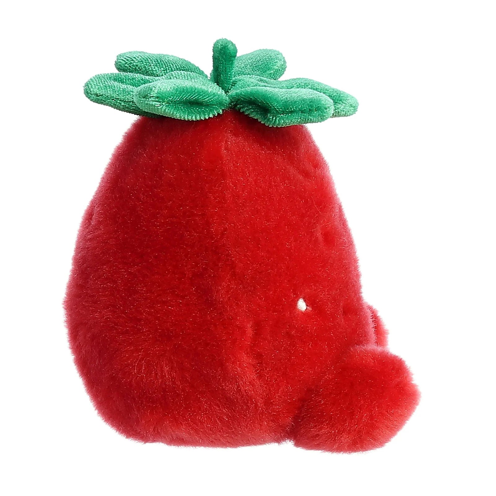 Plush strawberry toy with a smiling face on a white background