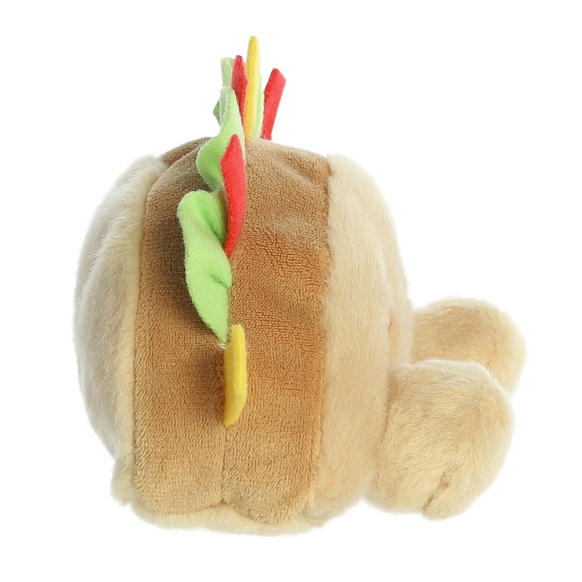Plush toy resembling a hot dog with vegetables on a white background