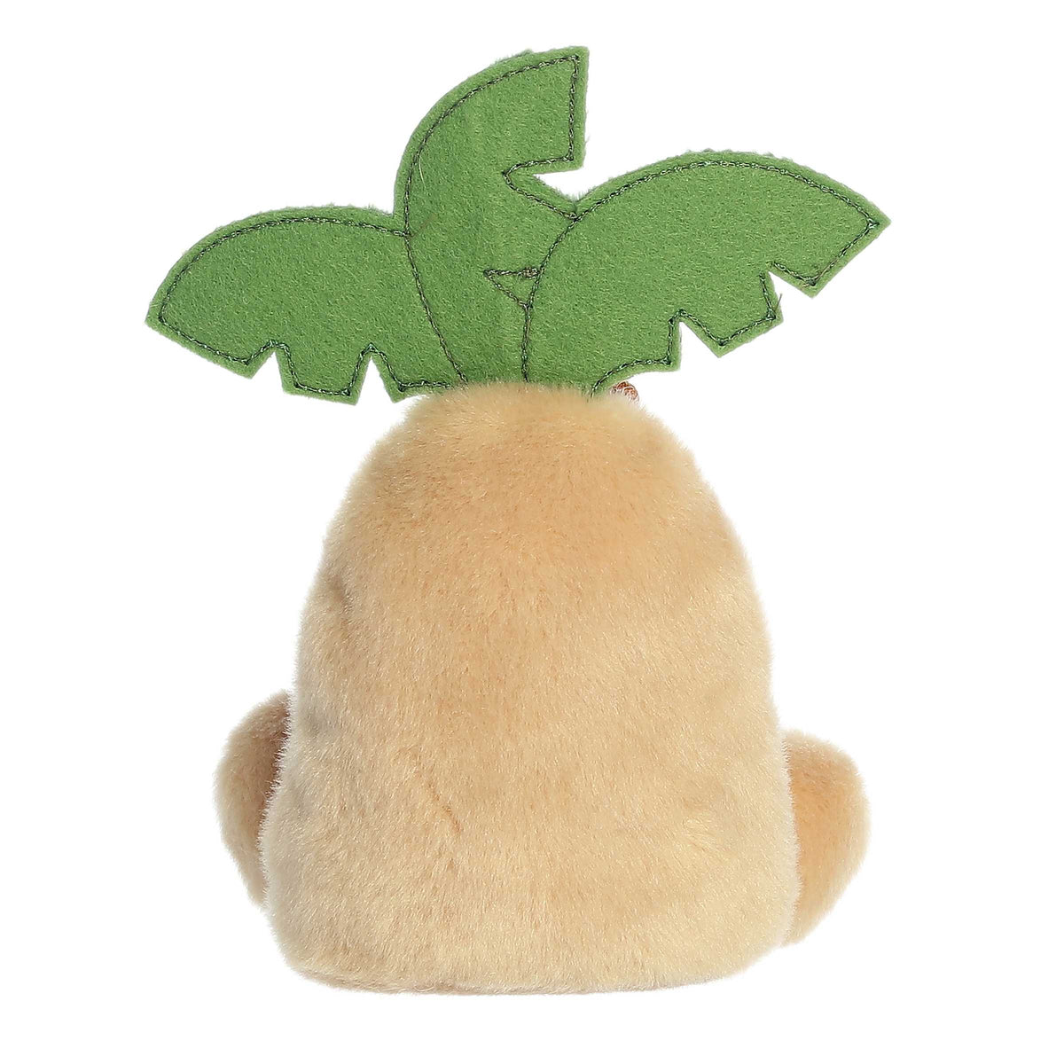 Small plush toy resembling a palm tree with a green leaf on top, on a white background