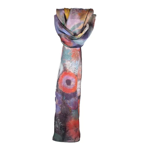 A lightweight scarf with an abstract, painterly print featuring a prominent orange-red circular motif, purple and blue tones, and hints of yellow, draped against a plain white background.