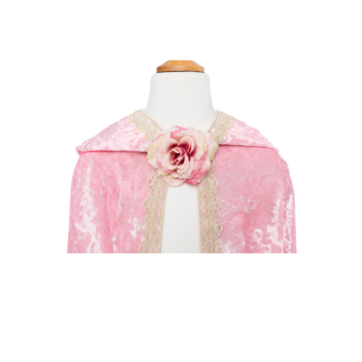 Pink cape with floral embellishment on a mannequin against a white background