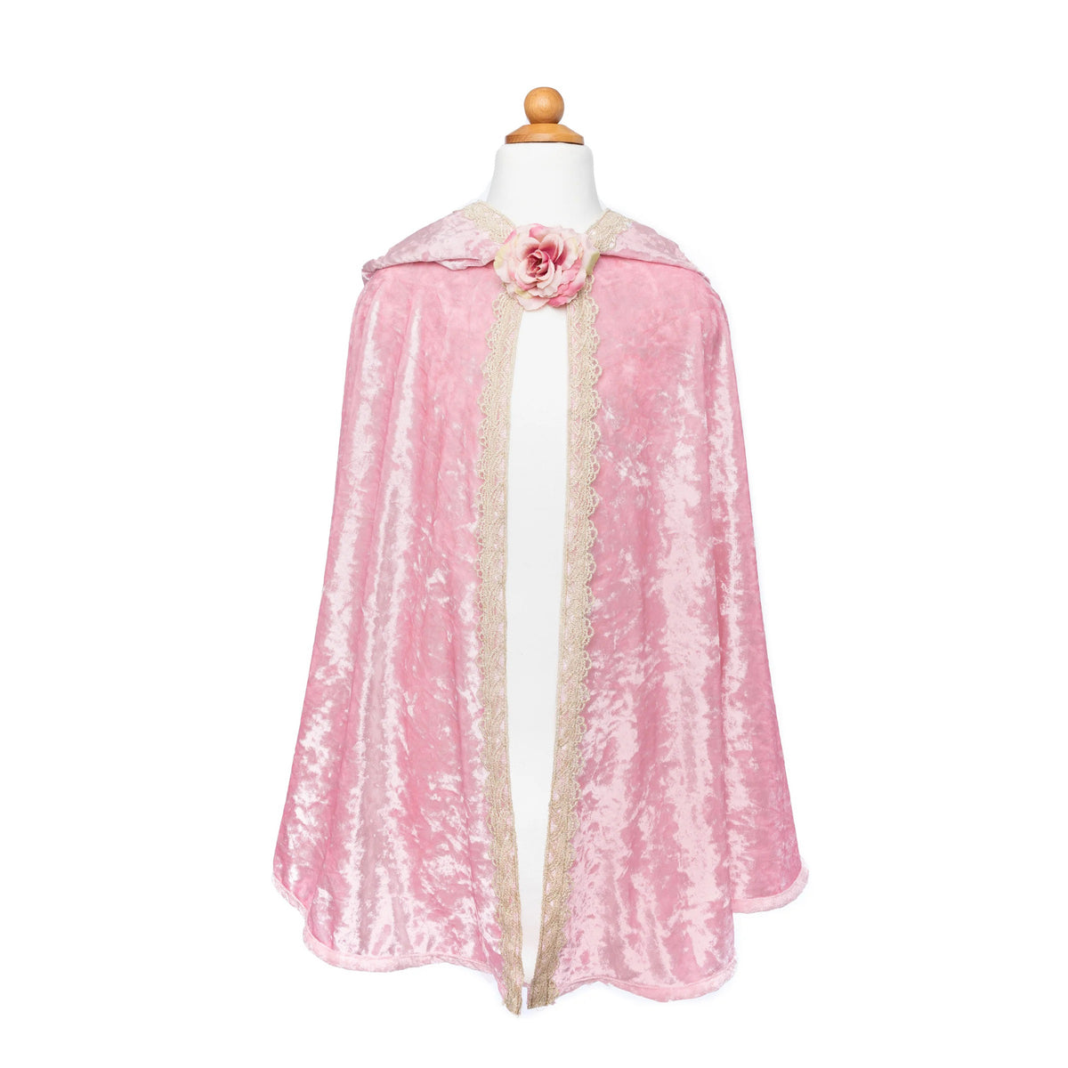 Pink cape with a floral detail on a mannequin against a white background