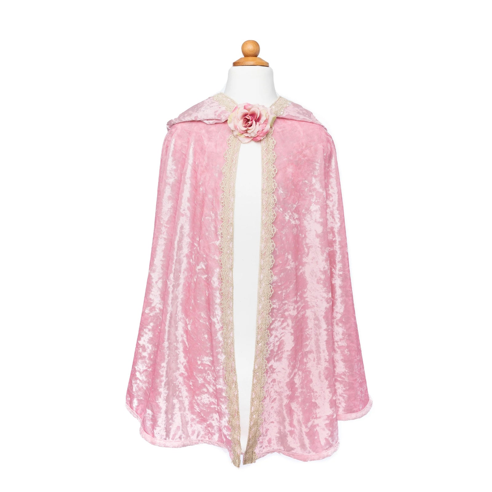Pink cape with a floral detail on a mannequin against a white background
