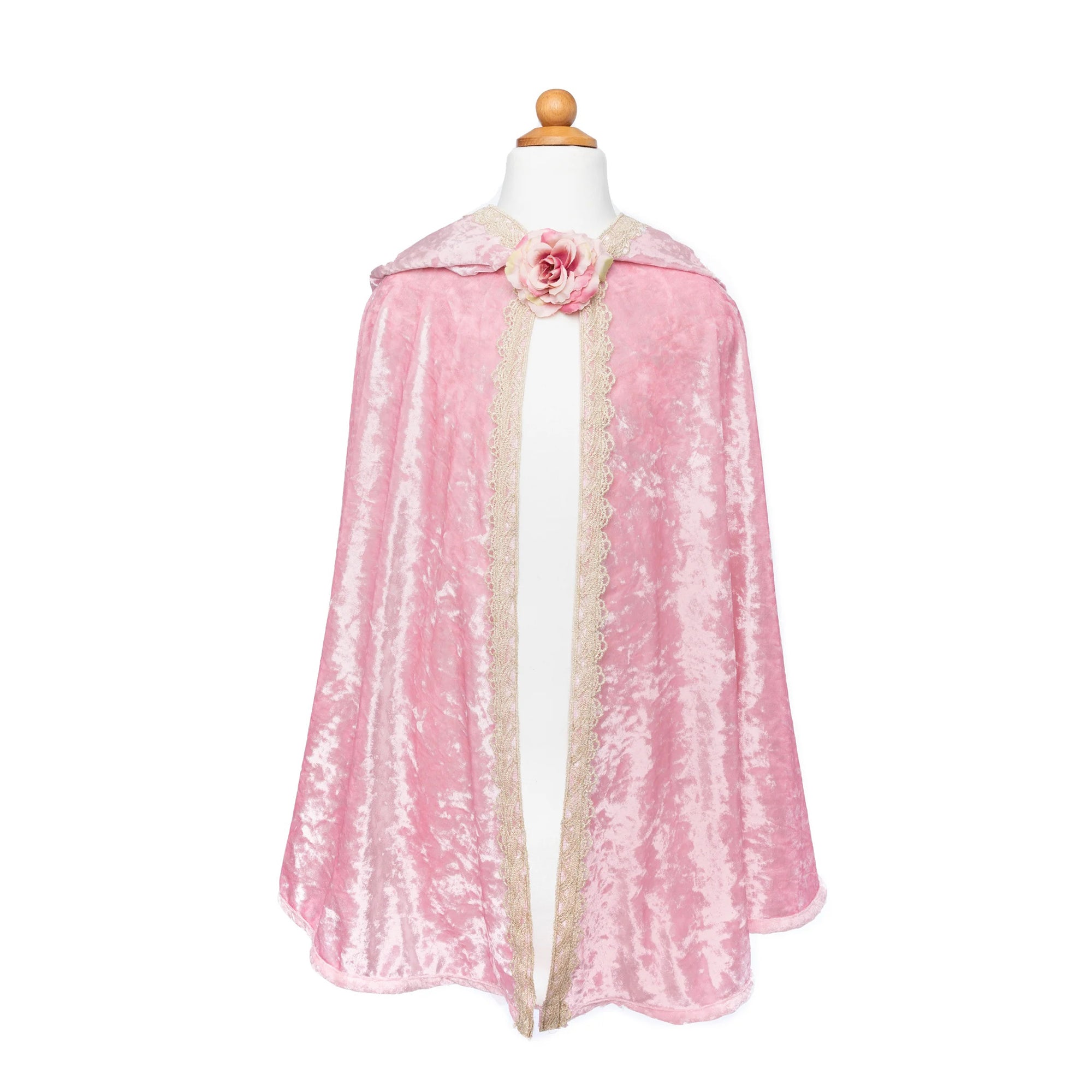 Pink cape with a floral detail on a mannequin against a white background