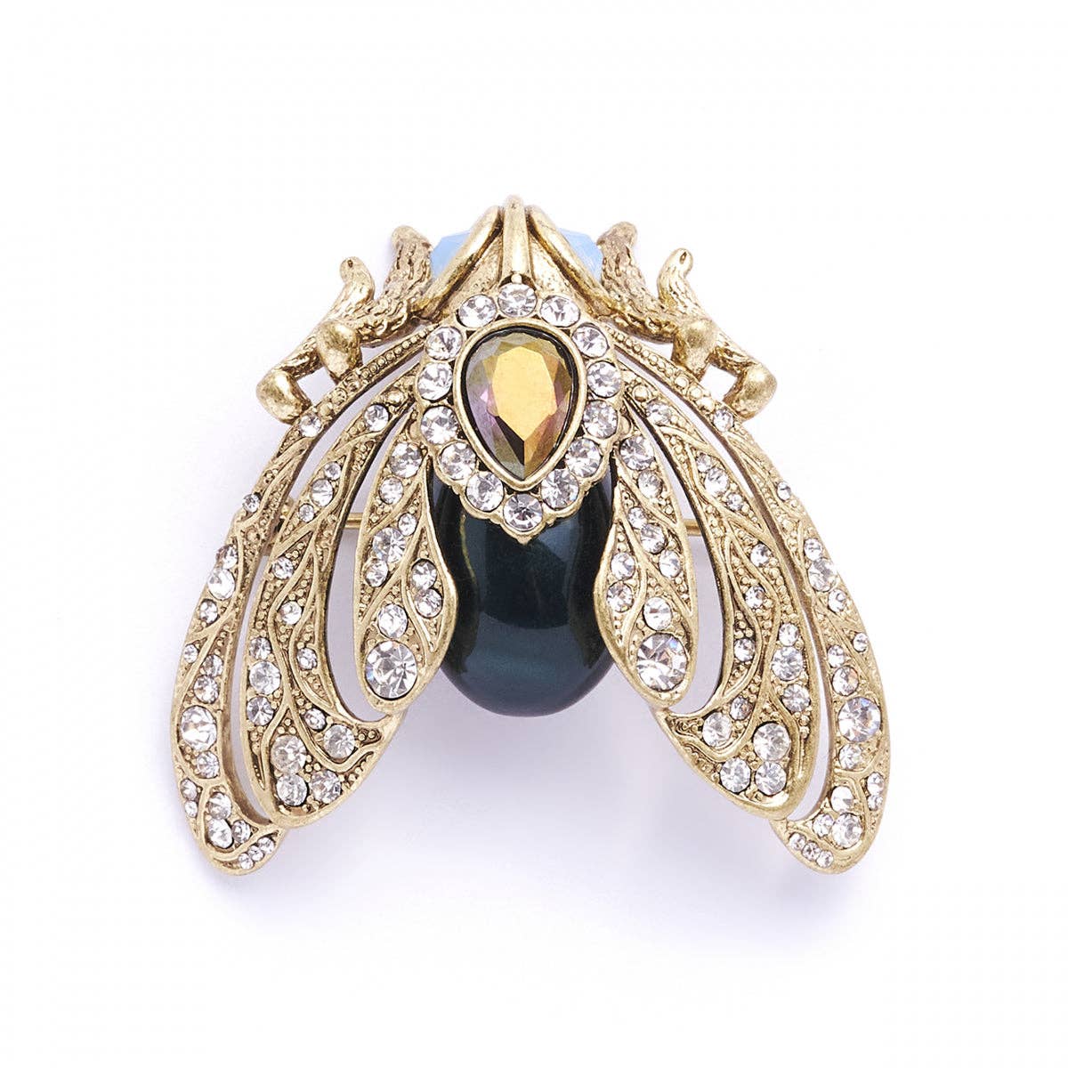 Decorative brooch with gold detailing and a black central gem on a white background