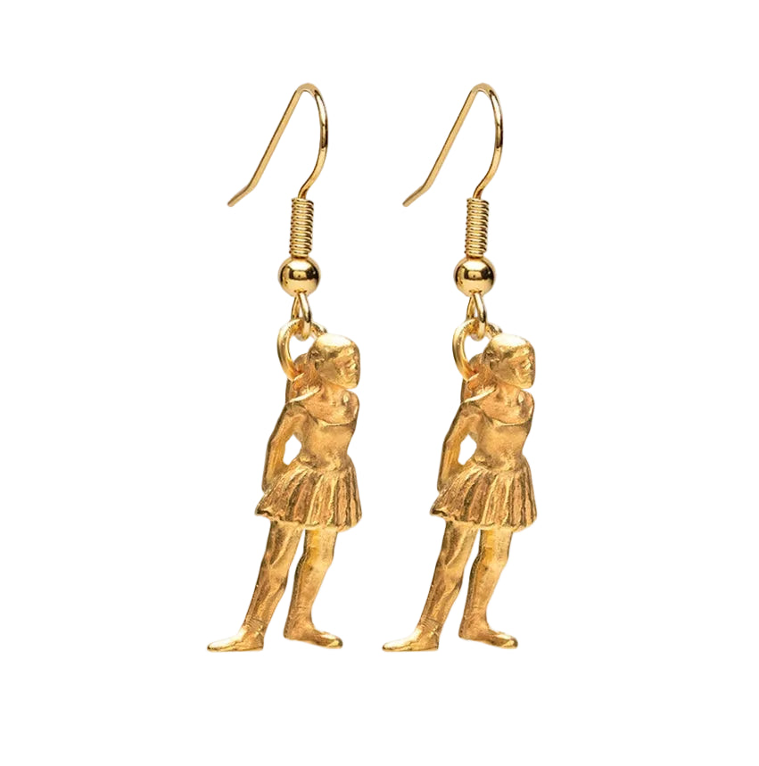 Gold ballerina shaped earrings on a white background