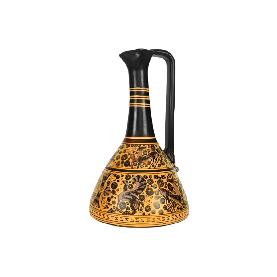 A ceramic Corinthian jug with a black handle and gold body, featuring intricate black patterns.