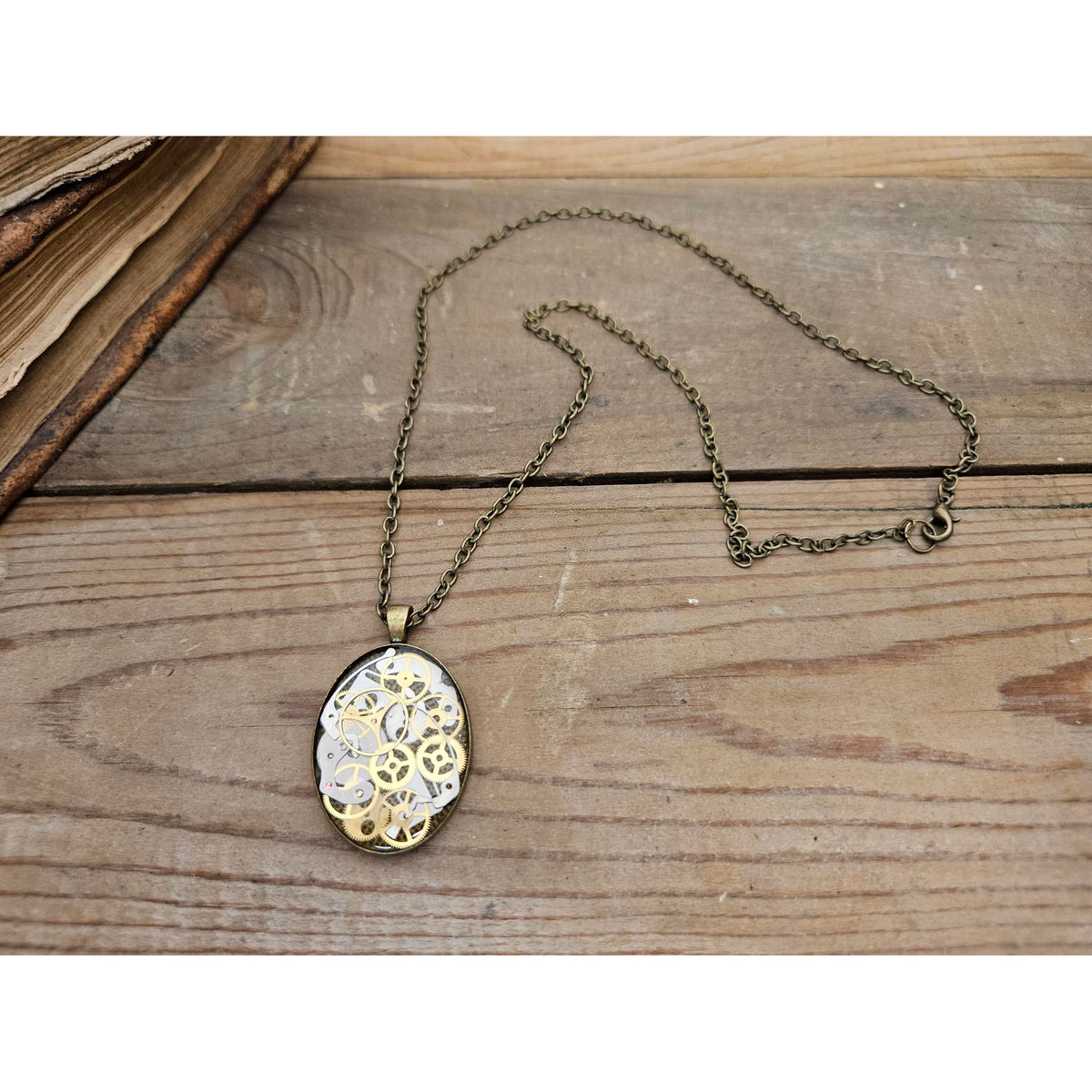 Necklace with a decorative pendant on a wooden surface