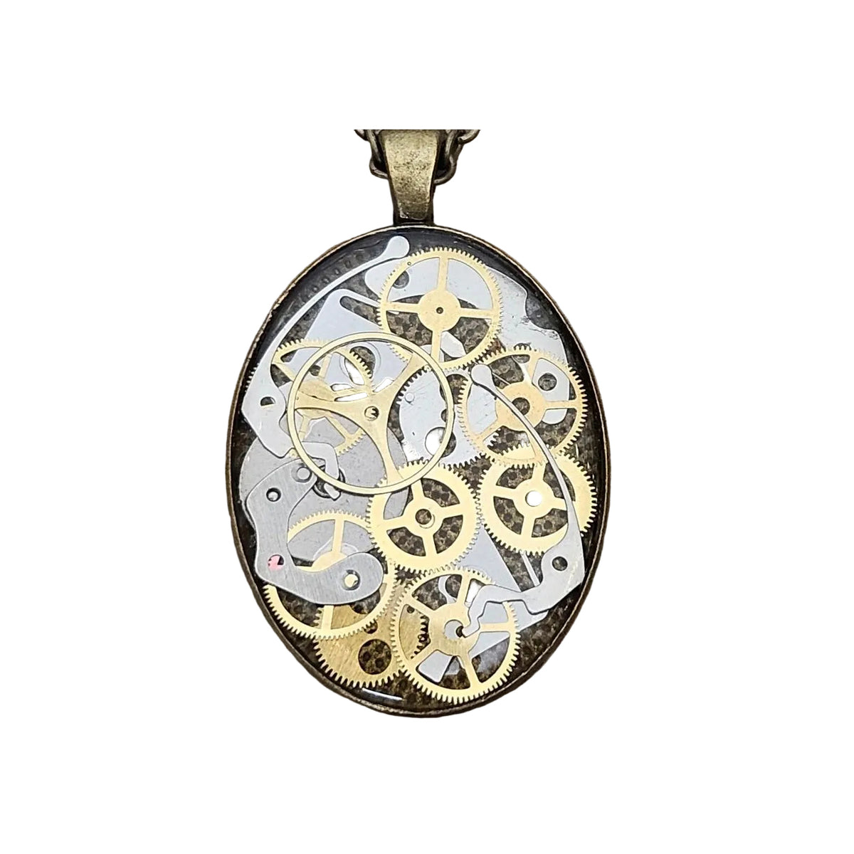 Pendant with intricate gold and silver gears on a white background