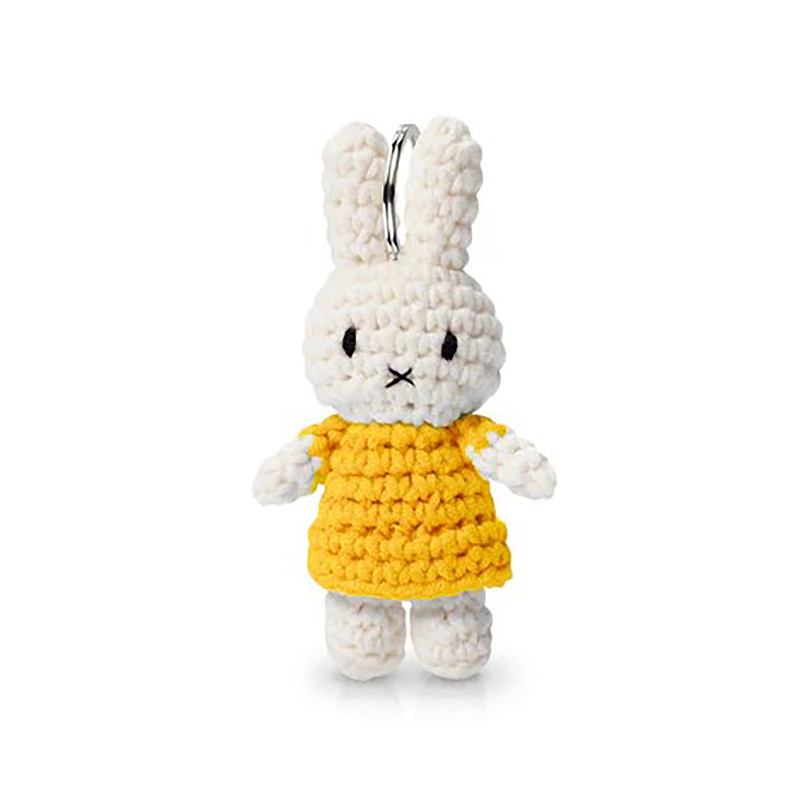 Crocheted rabbit keychain with a yellow dress on a white background