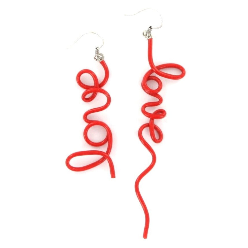 Red spiral earrings spelling out the word "love" on a white background