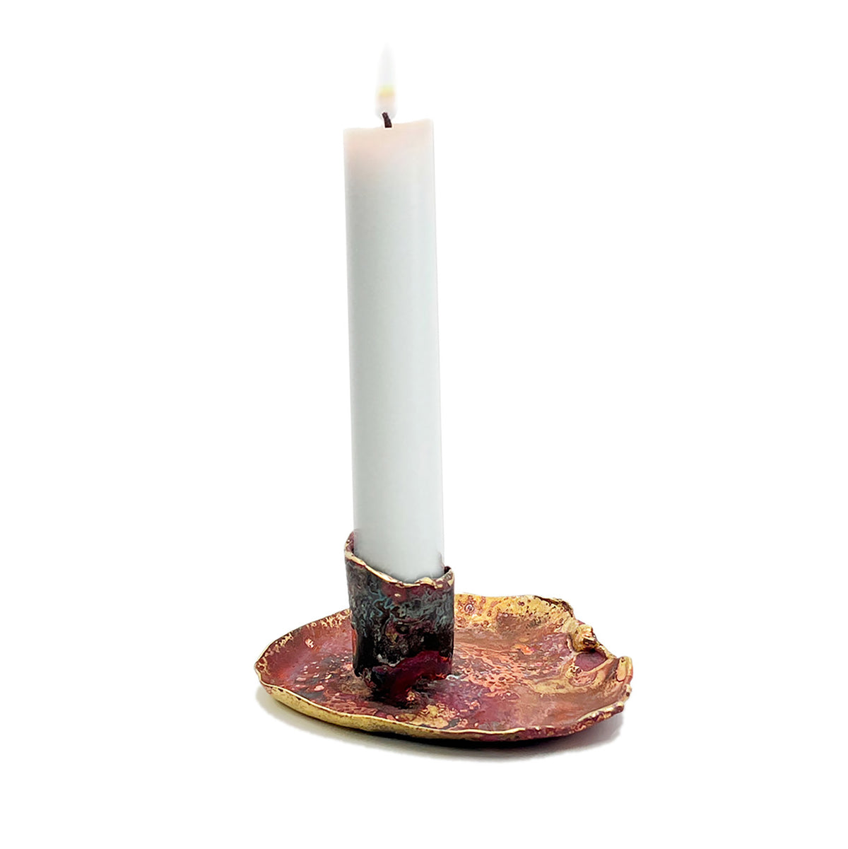 Candle in a decorative holder on a white background