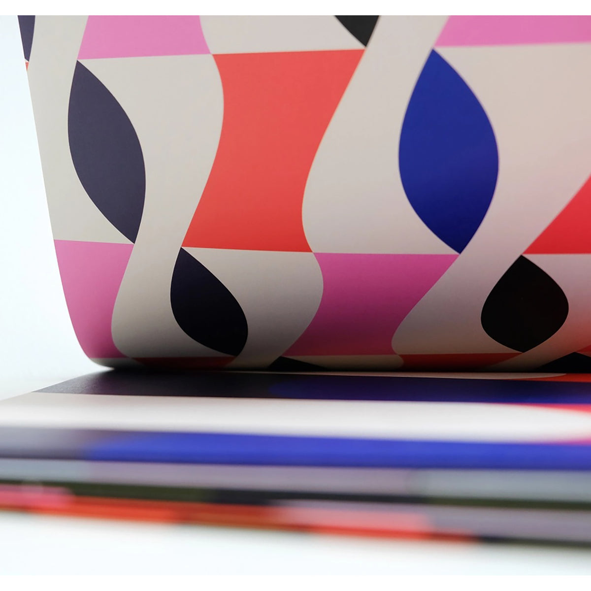 Colorful geometric-patterned fabric on a white background